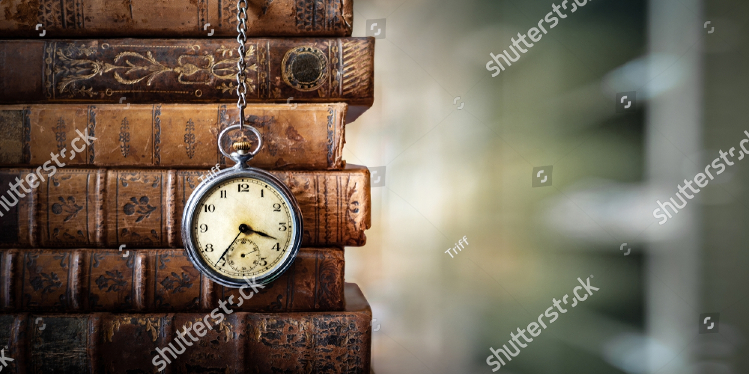 stock-photo-vintage-clock-hanging-on-a-chain-on-the-background-of-old-books-old-watch-as-a-symbol-of-passing-1405423262_copy_1500x750